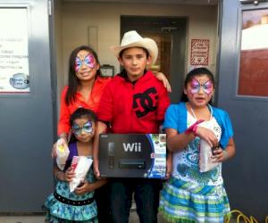 (Pictured:  The Castillo family were the proud winners of the Wii gaming system and several games in the raffle)